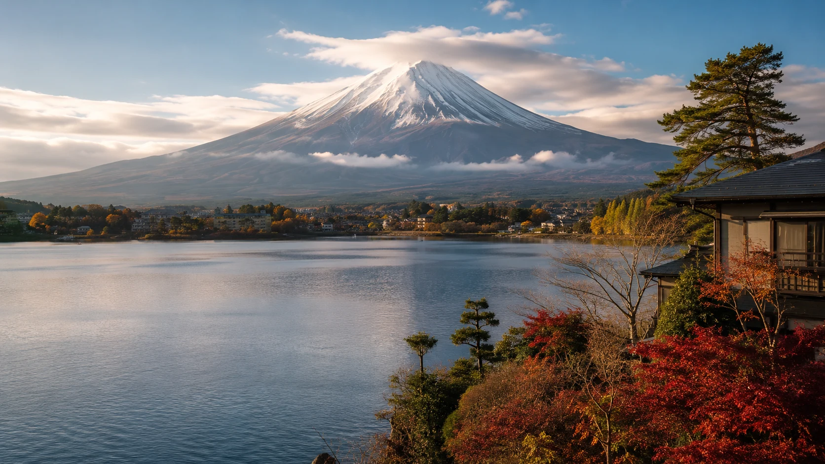 Mount Fuji rising above Lake Kawaguchiko with autumn foliage, Japan