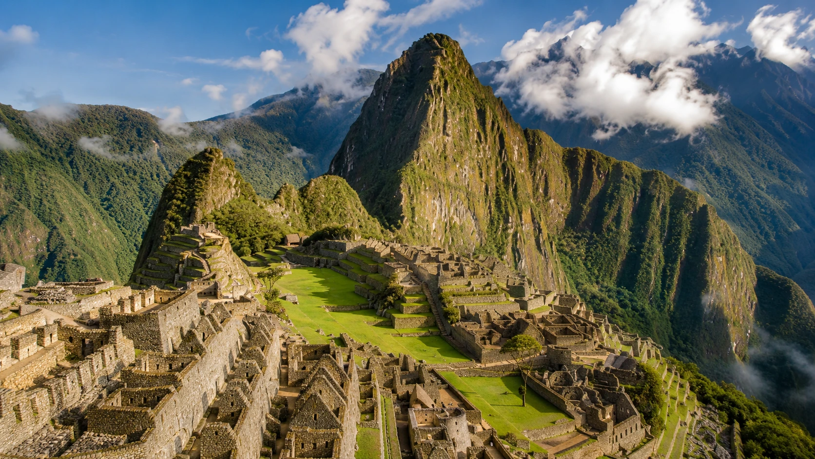 Machu Picchu's terraced ruins rising through the clouds, Peru